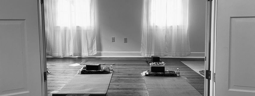 Yoga studio with mats and meditation cushions