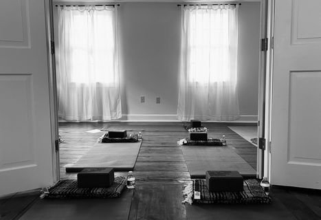 Yoga studio with mats and meditation cushions